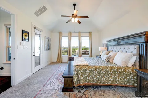 a bed room with a bed and a chandelier