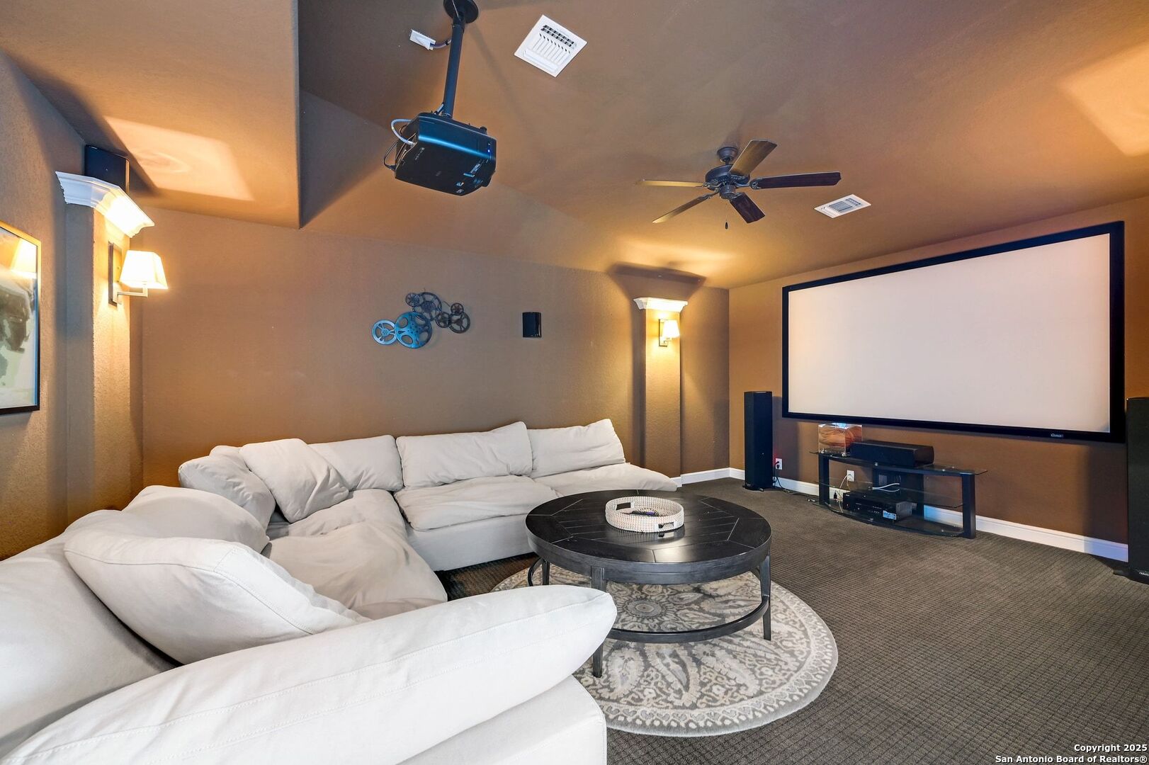 17023 Turin Ridge San Antonio, TX 78255 - Photo 30 of 48 a living room with furniture a ceiling fan and a rug