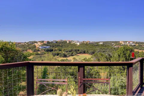 a view of a city skyline from a balcony