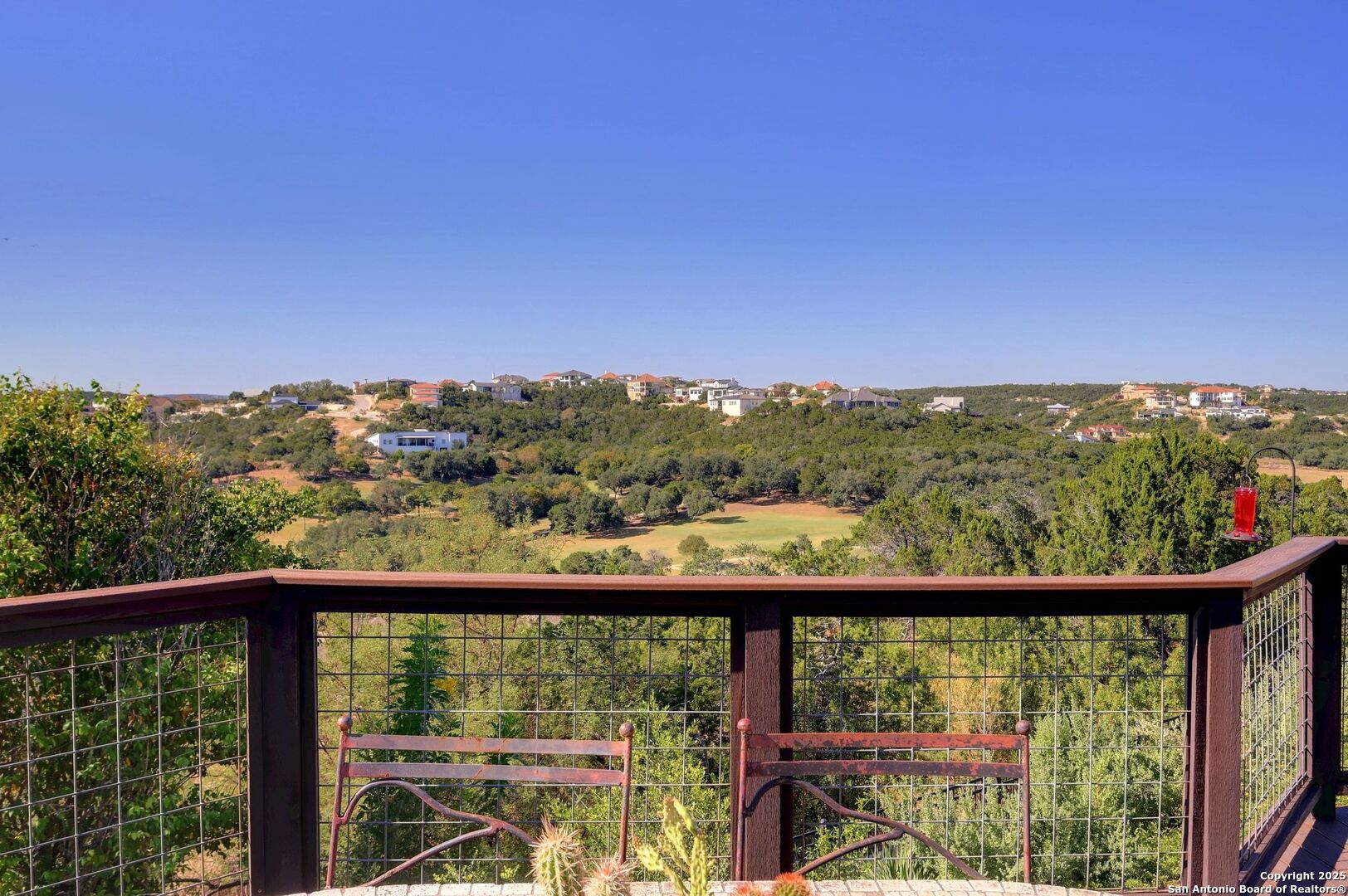 17023 Turin Ridge San Antonio, TX 78255 - Photo 3 of 48 a view of a city skyline from a balcony
