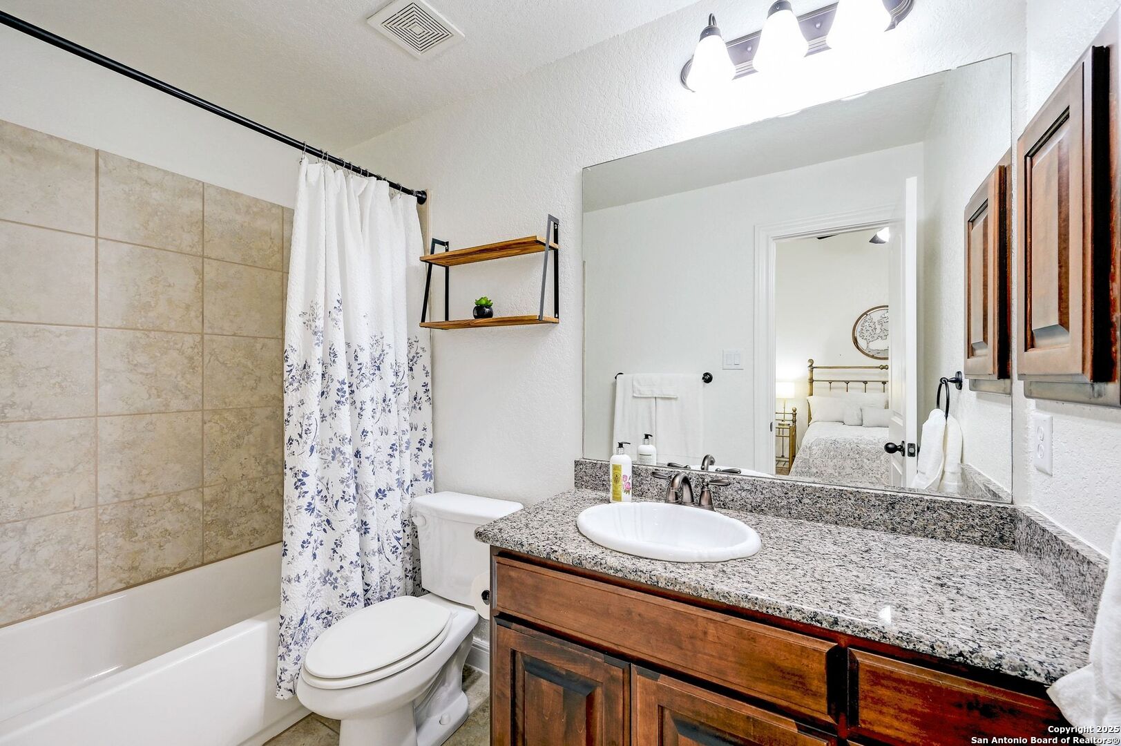 17023 Turin Ridge San Antonio, TX 78255 - Photo 35 of 48 a bathroom with a granite countertop sink toilet and shower
