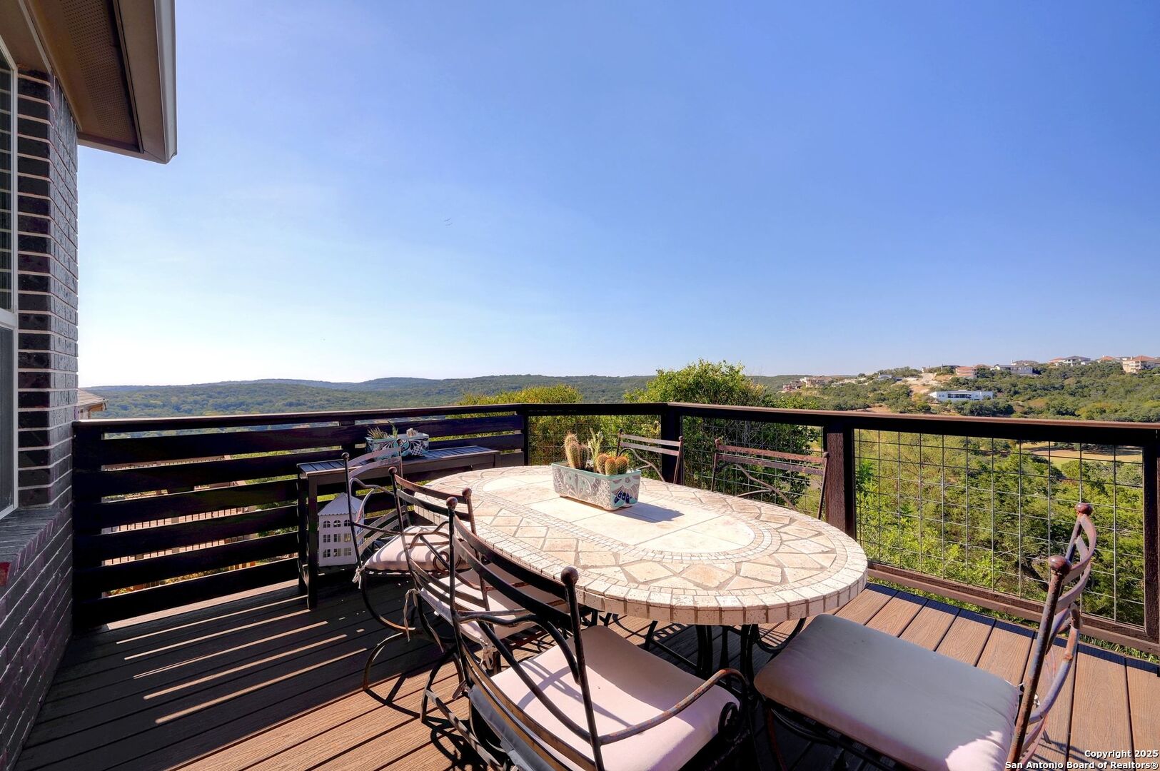 17023 Turin Ridge San Antonio, TX 78255 - Photo 41 of 48 a view of a balcony with a table and chairs
