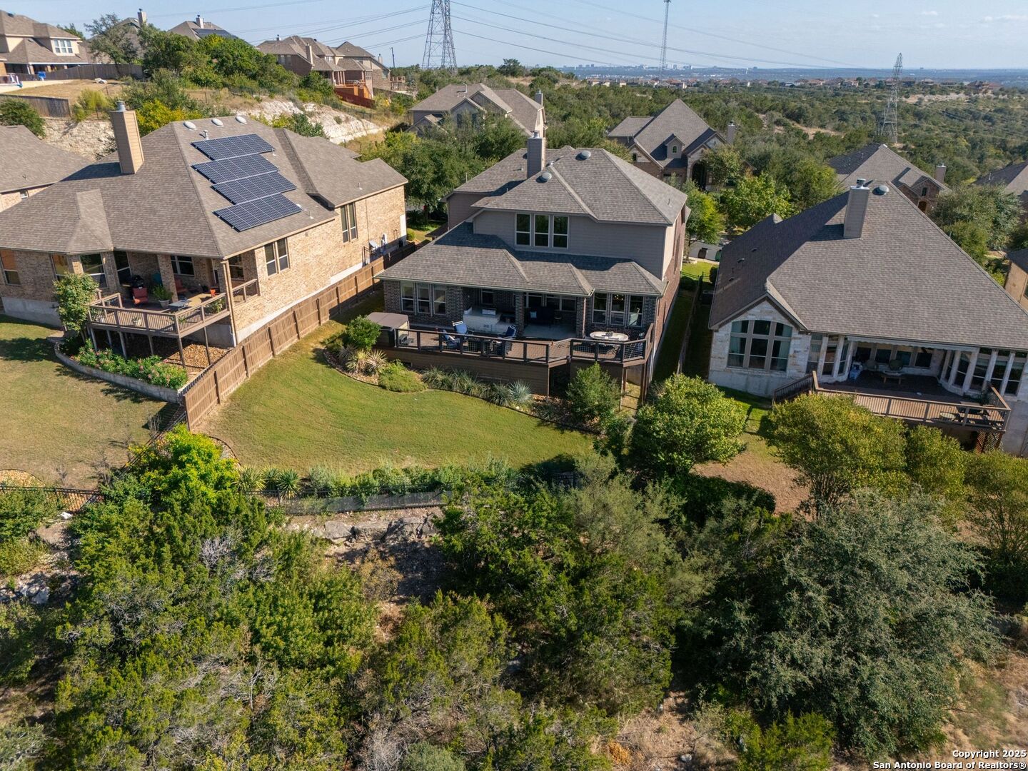 17023 Turin Ridge San Antonio, TX 78255 - Photo 45 of 48 an aerial view of a house with a garden and lake view
