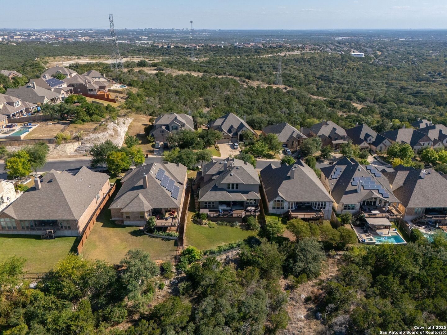 17023 Turin Ridge San Antonio, TX 78255 - Photo 46 of 48 an aerial view of a house with a garden and lake view
