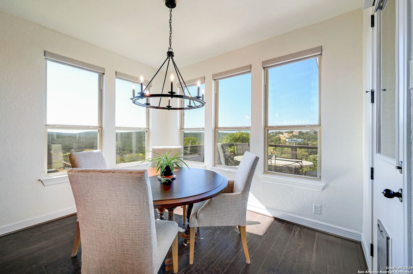17023 Turin Ridge San Antonio, TX 78255 - Photo 9 of 48 a view of a dining room with furniture window and wooden floor