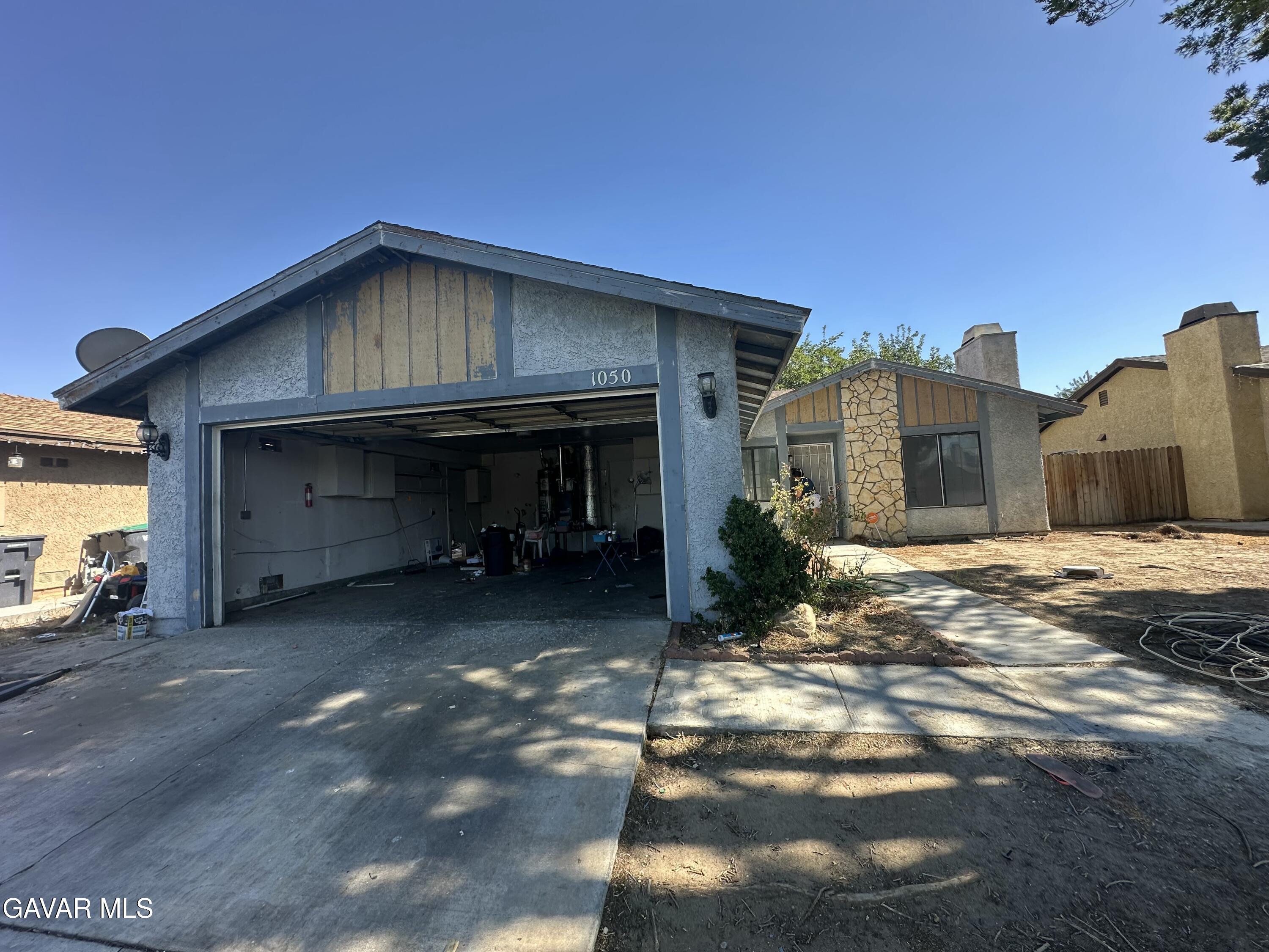 a view of a car park in front of house