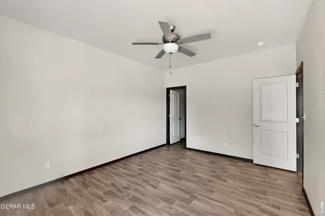 a bathroom with a granite countertop sink toilet a mirror and shower