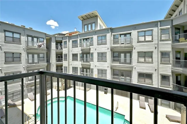 a view of a large building from a balcony