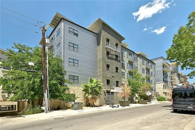 a front view of a building with street view