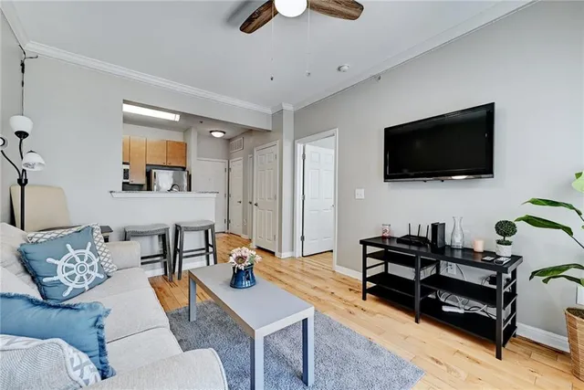 a living room with furniture and a flat screen tv