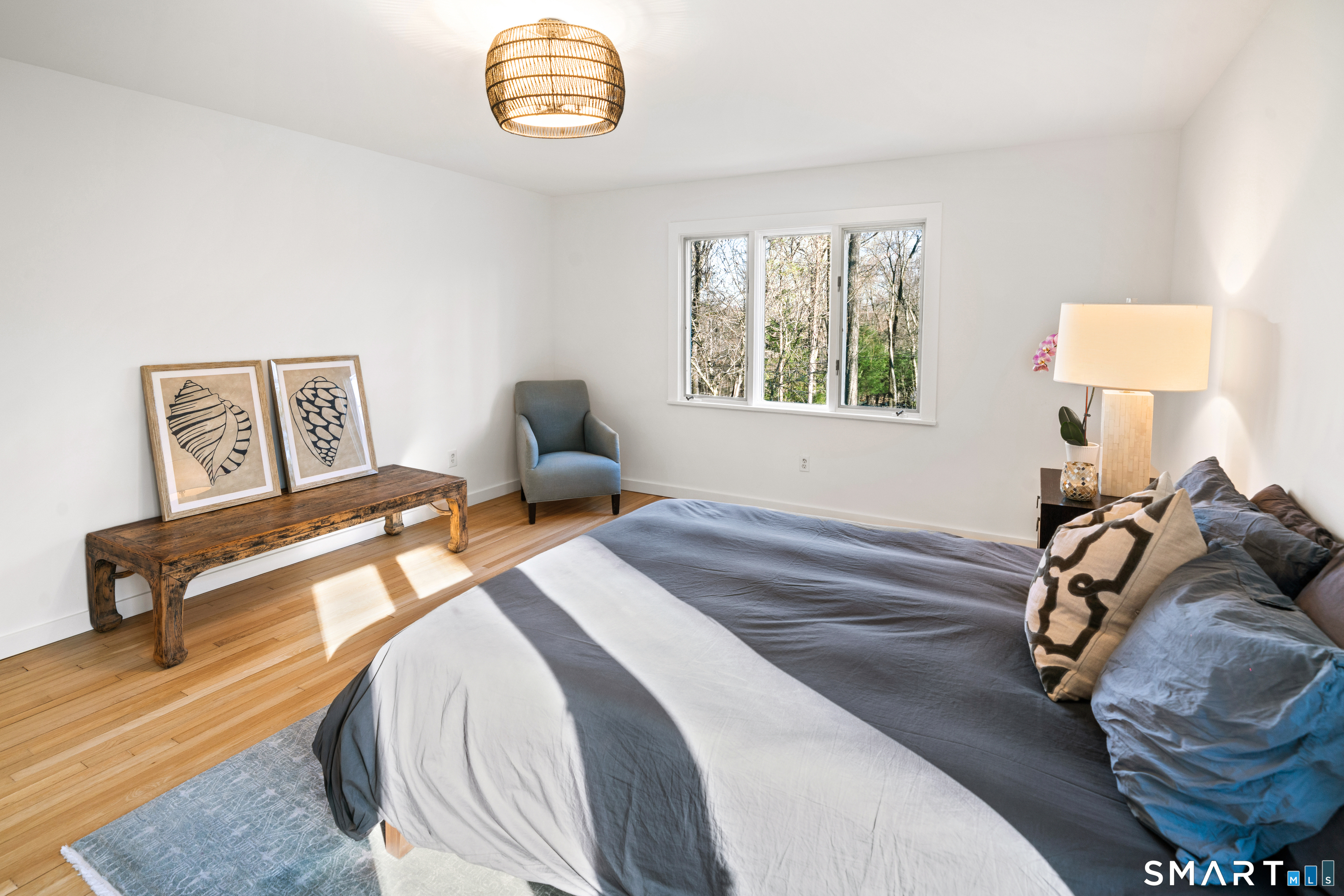 23 Norton Road Easton, CT 06612 - Photo 17 of 40 A main level bedroom with an adjacent full bath is ideally situated for easy conversion into a private primary or guest suite.