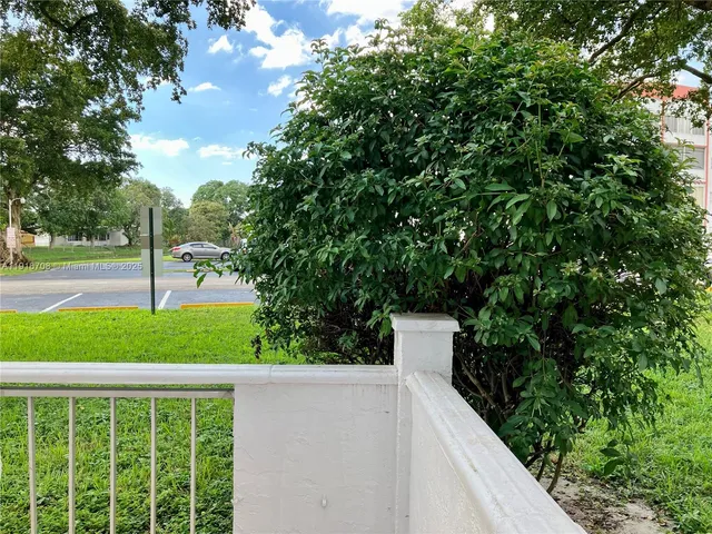 a view of outdoor space with deck and living room