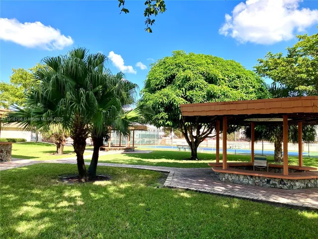a kitchen with a refrigerator and cabinets