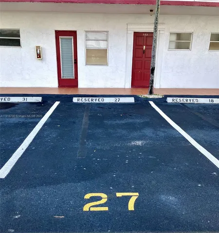 a kitchen with wooden cabinets and a stove top oven