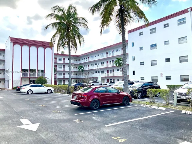 a view of a kitchen that has a window in it