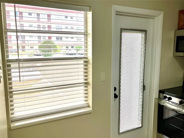 a kitchen with stainless steel appliances a stove and a refrigerator
