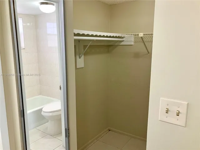 a swimming pool with trees in the background