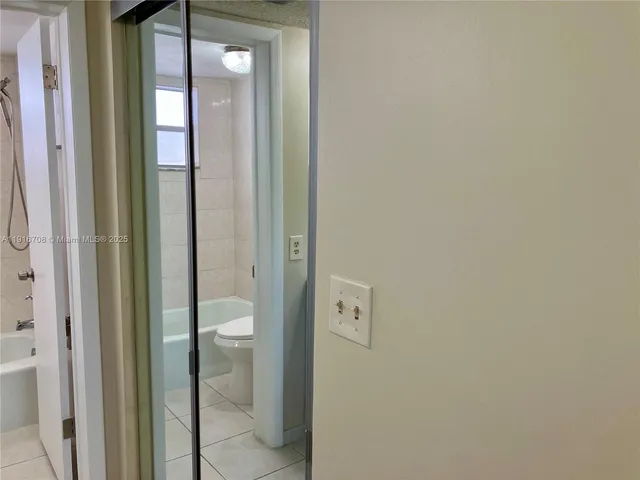 a view of a lake with a bench in a garden