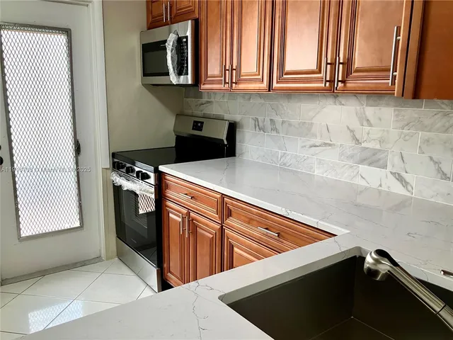 a view of a hallway with a glass door