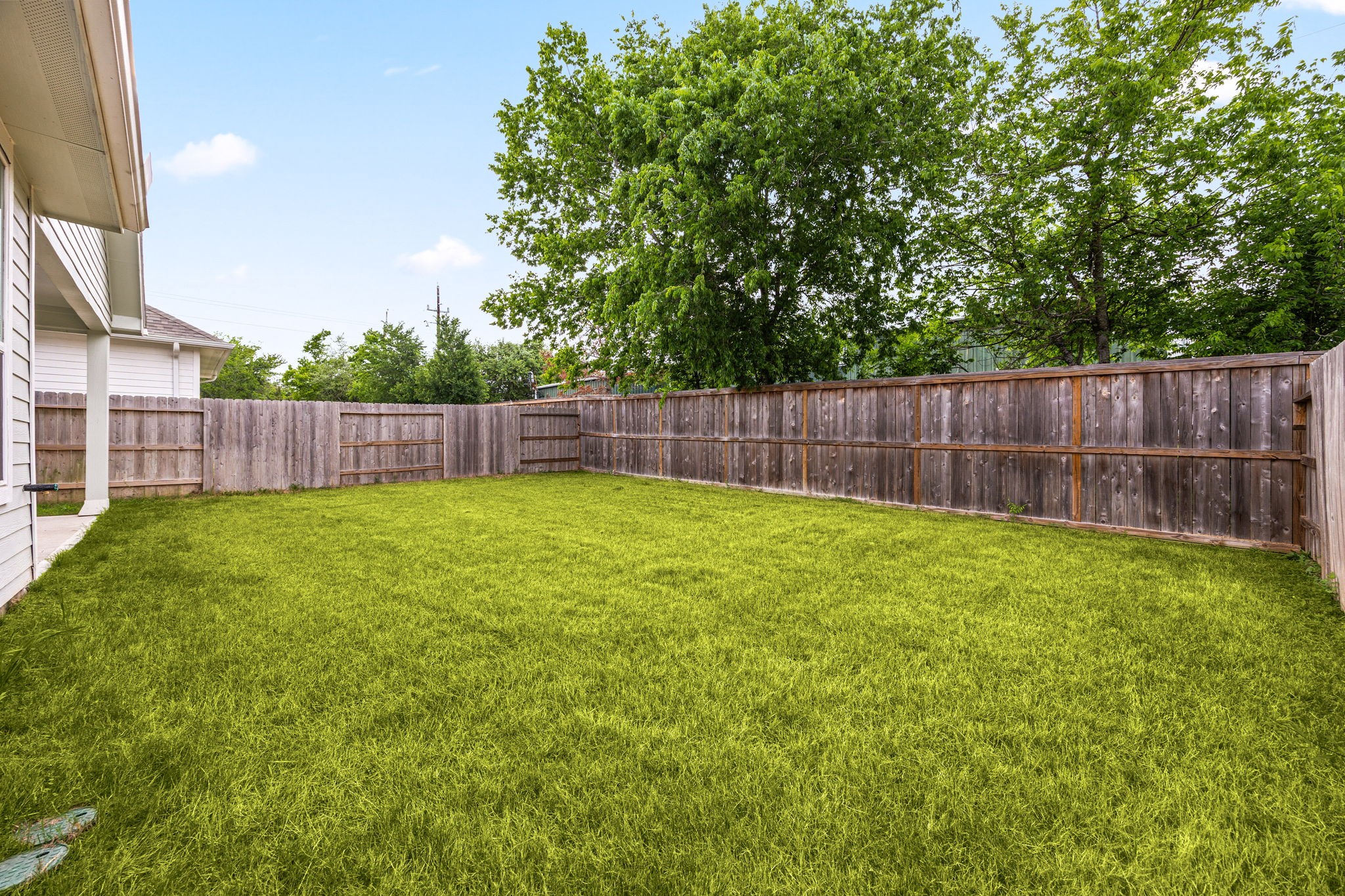 33142 School Hl Road Fulshear, TX 77441 - Photo 29 of 29 a view of a yard with a large tree and wooden fence