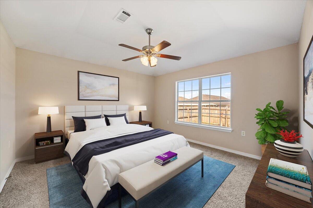 5414 Fawn Ridge Drive Gulf Breeze, FL 32563 - Photo 15 of 31 a bedroom with a bed and a chandelier