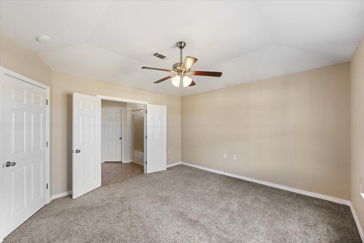 5414 Fawn Ridge Drive Gulf Breeze, FL 32563 - Photo 16 of 31 an empty room with closet and a ceiling fan
