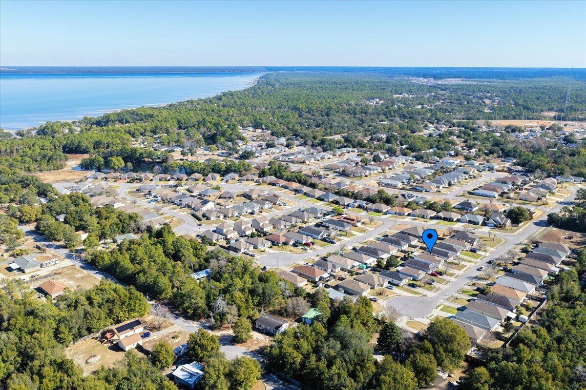 5414 Fawn Ridge Drive Gulf Breeze, FL 32563 - Photo 26 of 31 an aerial view of a city with lots of residential buildings