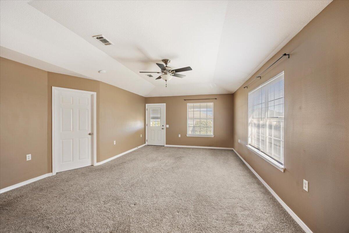 5414 Fawn Ridge Drive Gulf Breeze, FL 32563 - Photo 5 of 31 a view of a livingroom with a ceiling fan and window
