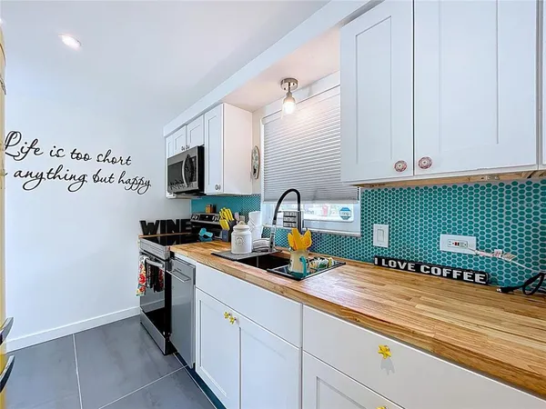 a reading room with furniture and wooden floor