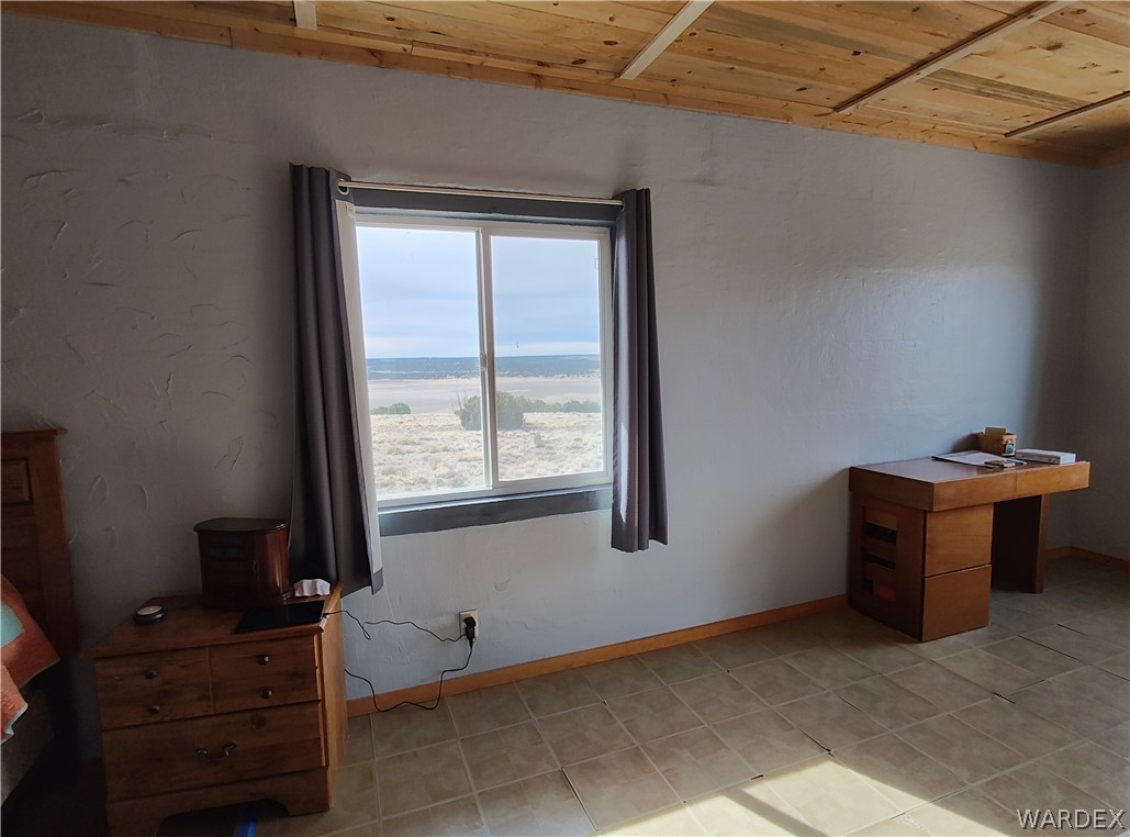 15 County Road Concho, AZ 85924 - Photo 11 of 93 Neutral wall finishes complementing a wood-paneled ceiling