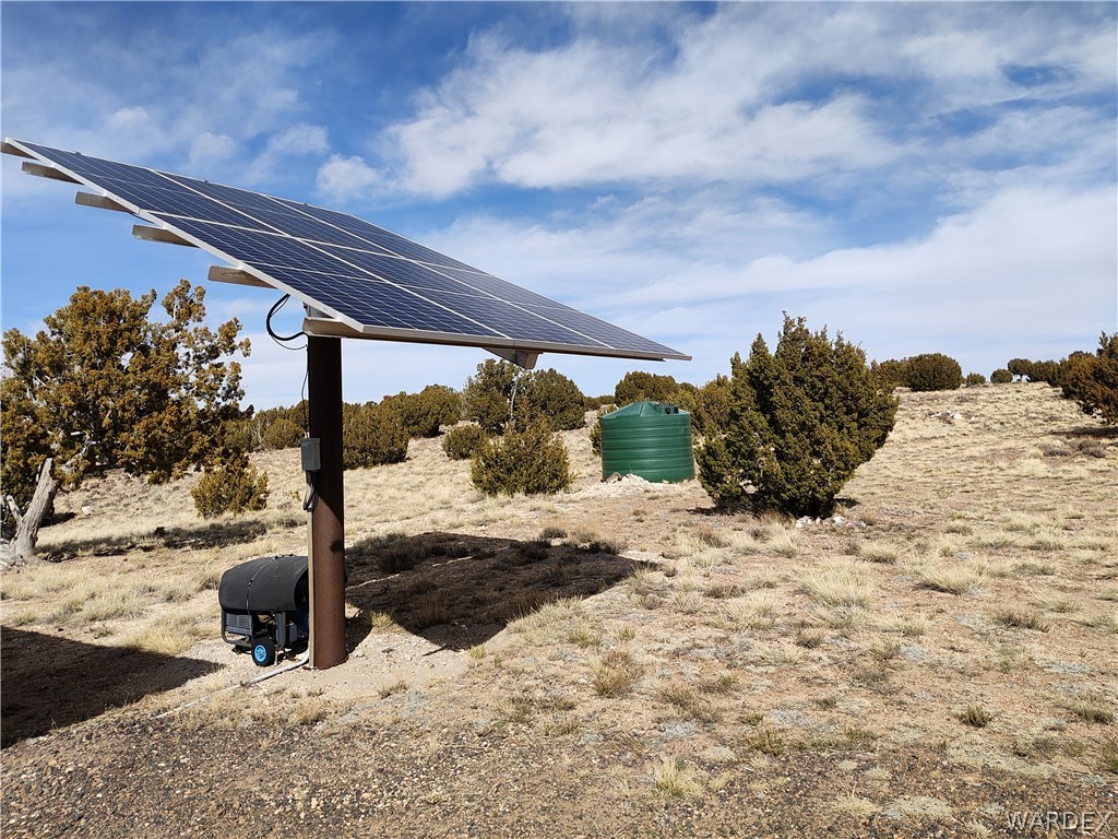 15 County Road Concho, AZ 85924 - Photo 33 of 93 Solar panel array with a dark brown support post