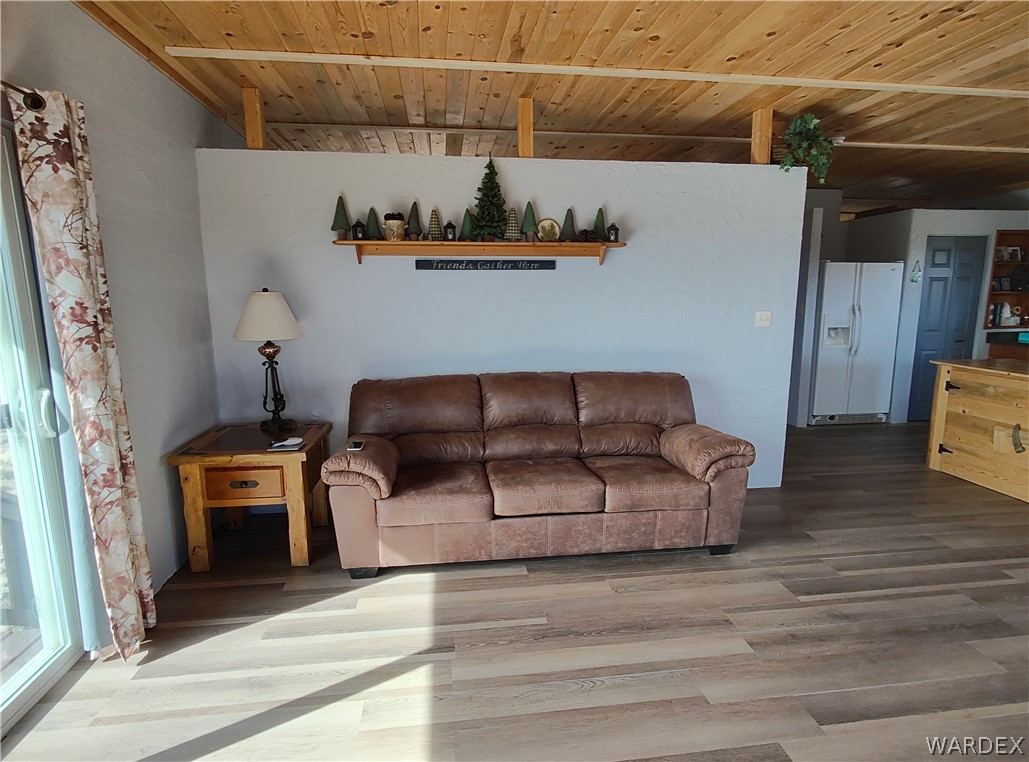 15 County Road Concho, AZ 85924 - Photo 4 of 93 Wood-finish flooring throughout, complemented by a light wood-plank ceiling