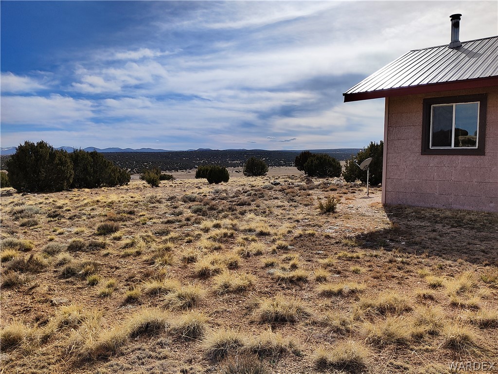 15 County Road Concho, AZ 85924 - Photo 62 of 93 Single-story residence featuring a metal roof, block exterior, and a single pane window with a dark frame