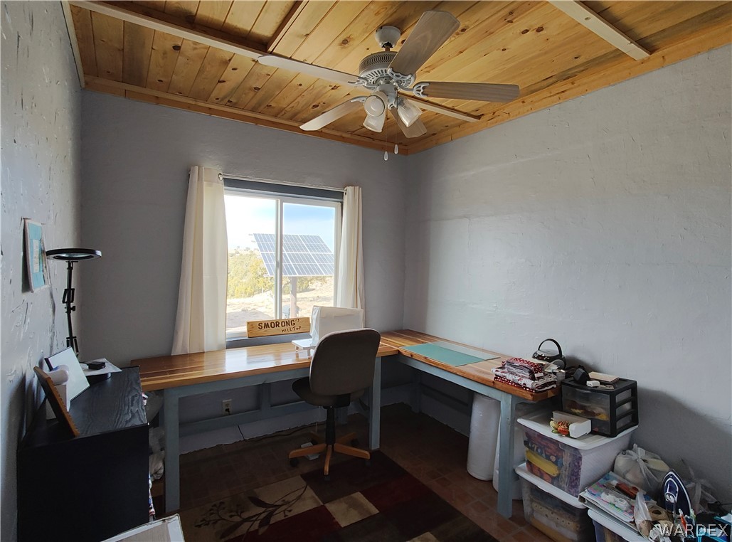 15 County Road Concho, AZ 85924 - Photo 8 of 93 Room featuring a wood-finish vaulted ceiling, ceiling fan with integrated lighting, and a window providing natural light