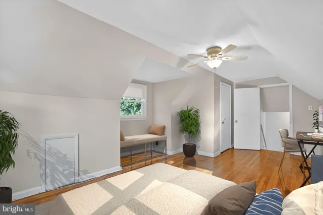 a bathroom with a window and a shower