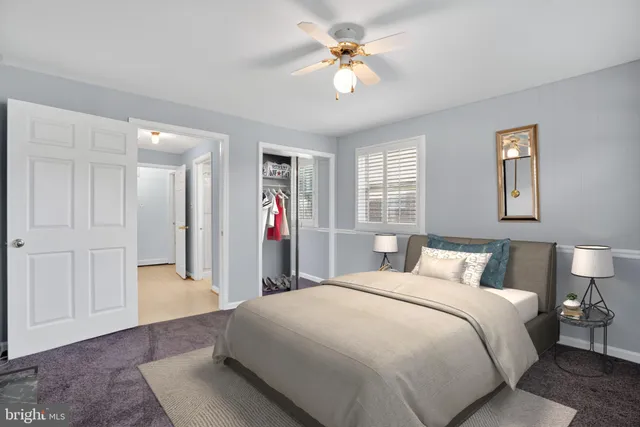 a very nice looking room with a large window and couch