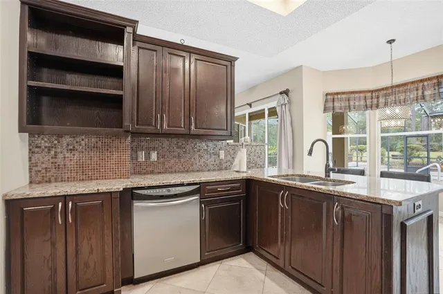 a kitchen with a sink and cabinets