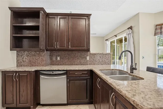 a view of a livingroom with furniture and windows
