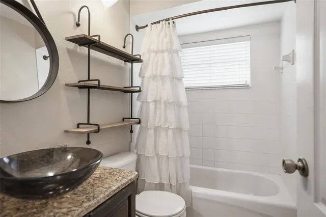 a view of a swimming pool with a patio