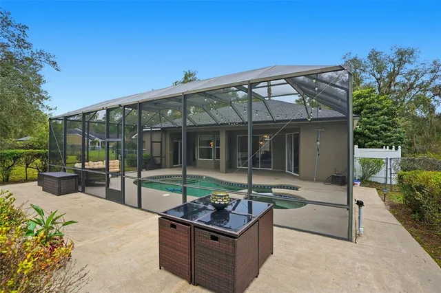 a view of a green field with lots of bushes