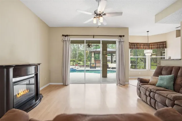 a kitchen with stainless steel appliances granite countertop a sink and dishwasher a stove with wooden cabinets