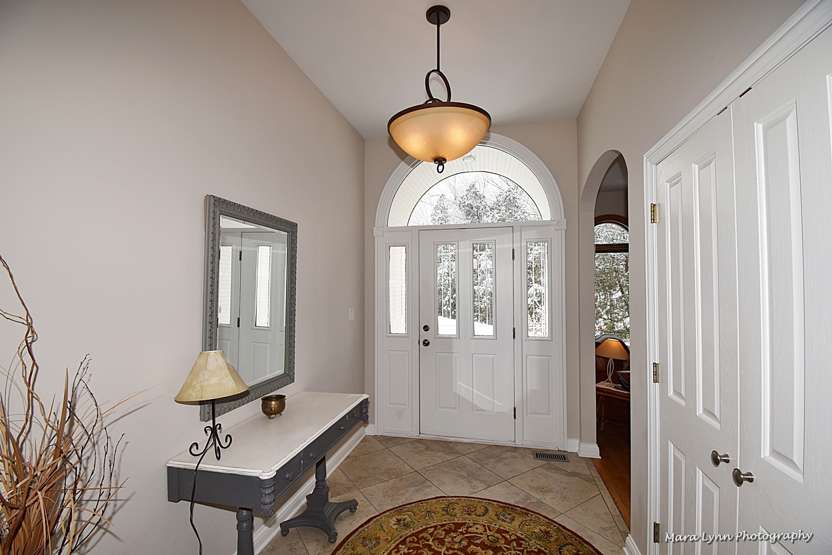6N353 State Rte 31 St. Charles, IL 60175 - Photo 2 of 124 a view of a livingroom with furniture mirror front door and furniture