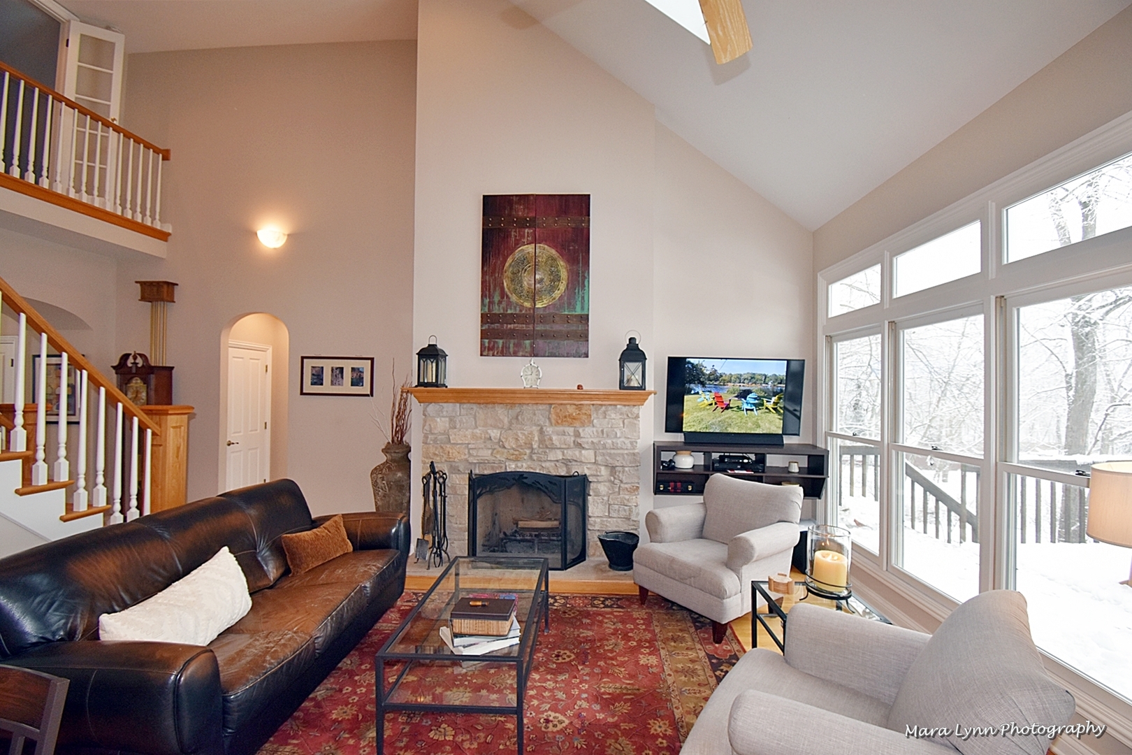 6N353 State Rte 31 St. Charles, IL 60175 - Photo 17 of 124 a living room with furniture a fireplace and a flat screen tv