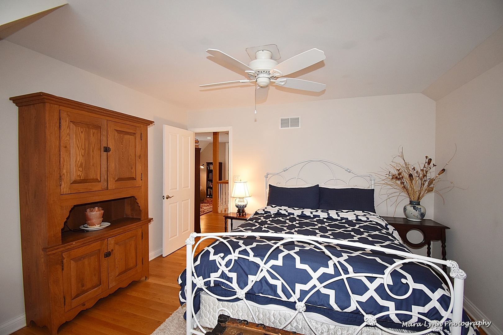 6N353 State Rte 31 St. Charles, IL 60175 - Photo 43 of 124 a bedroom with a bed and a lamp on the dresser