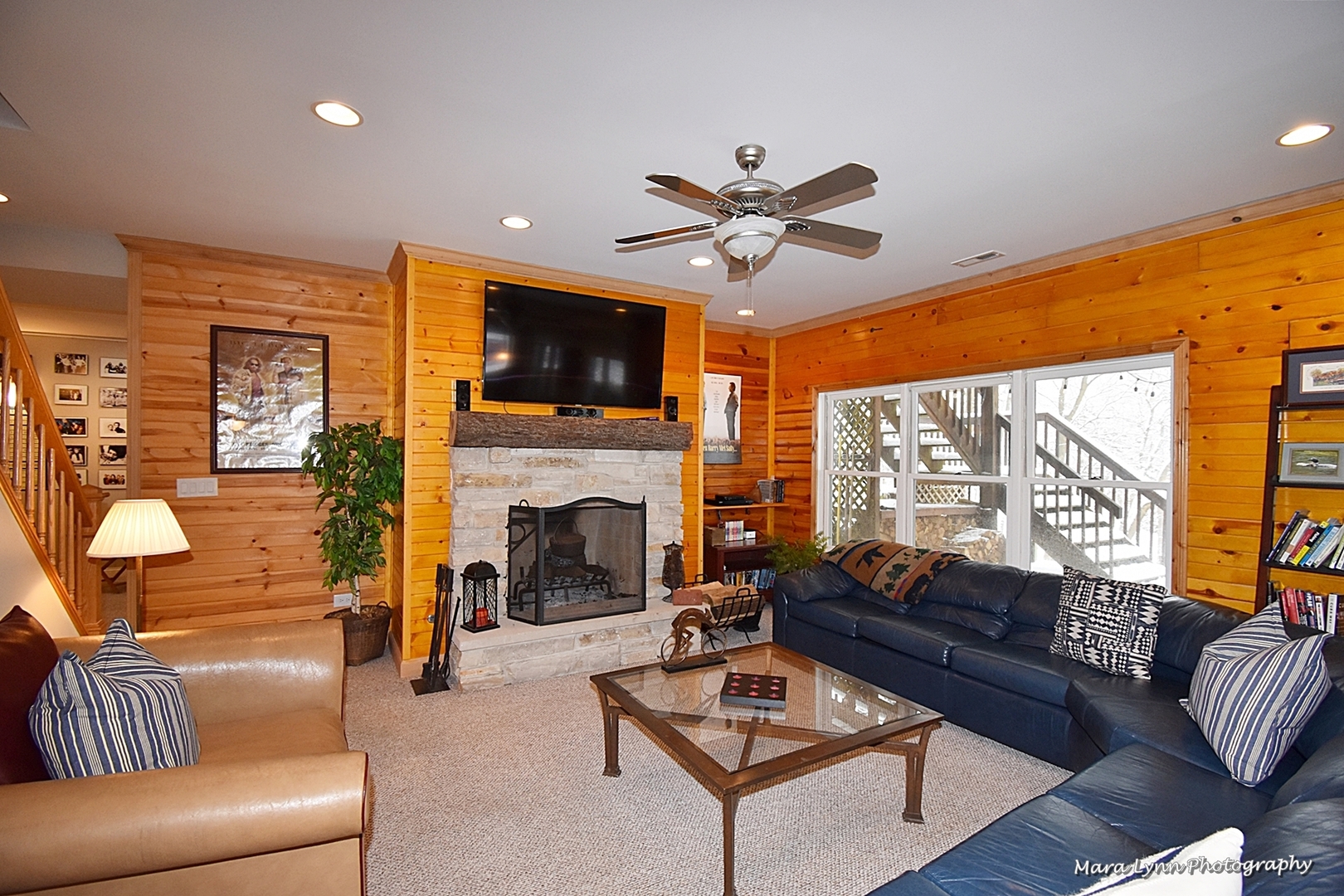 6N353 State Rte 31 St. Charles, IL 60175 - Photo 49 of 124 a living room with furniture a fireplace and a flat screen tv