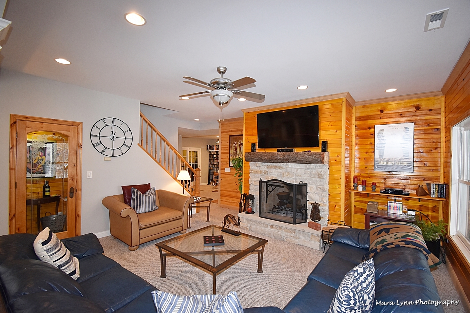 6N353 State Rte 31 St. Charles, IL 60175 - Photo 50 of 124 a living room with furniture a fireplace and a flat screen tv