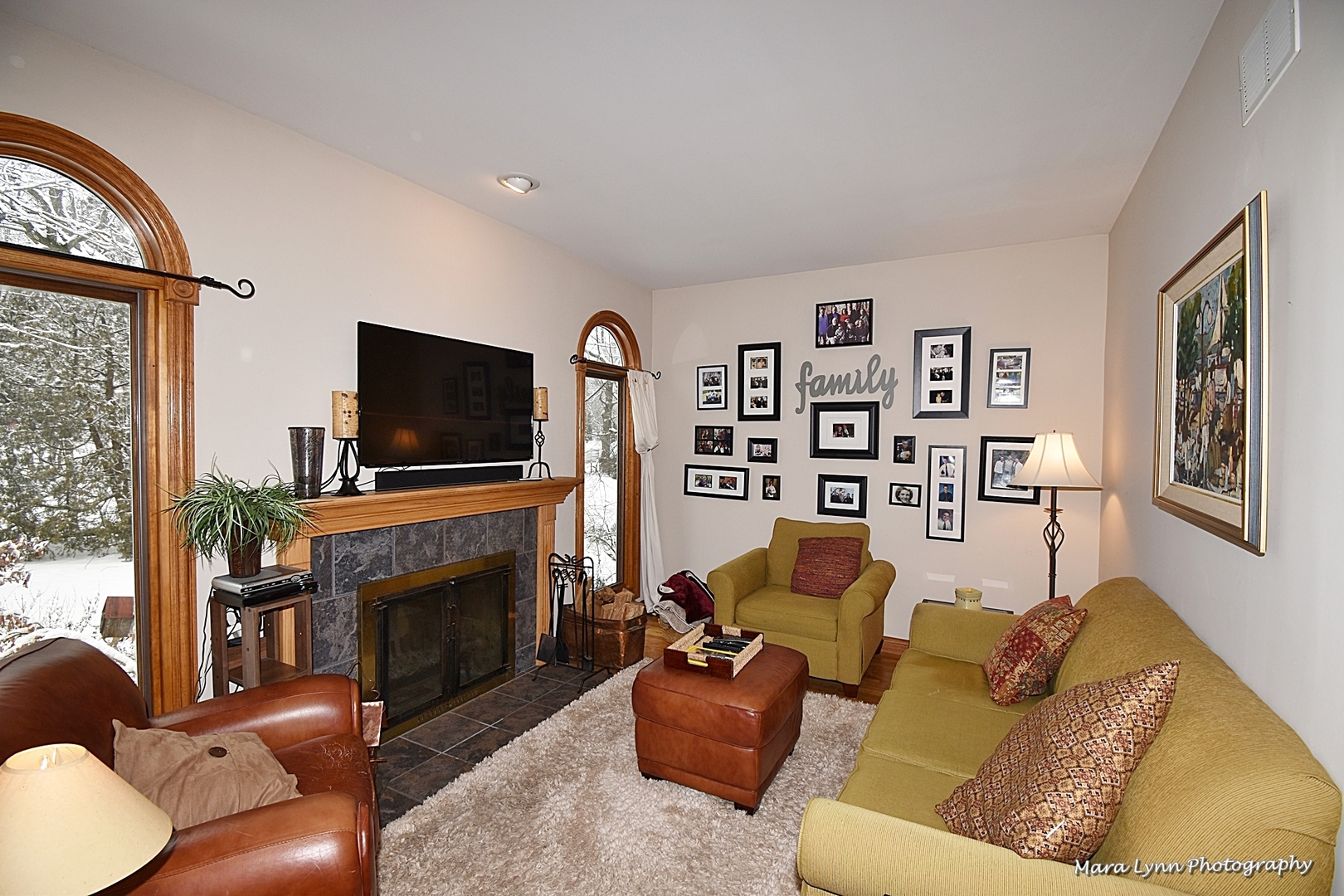 6N353 State Rte 31 St. Charles, IL 60175 - Photo 6 of 124 a living room with furniture a flat screen tv and a fireplace