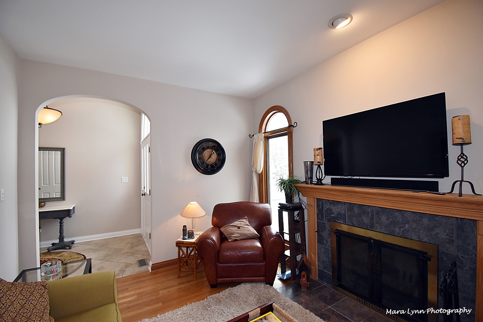 6N353 State Rte 31 St. Charles, IL 60175 - Photo 7 of 124 a living room with furniture a fireplace and a flat screen tv