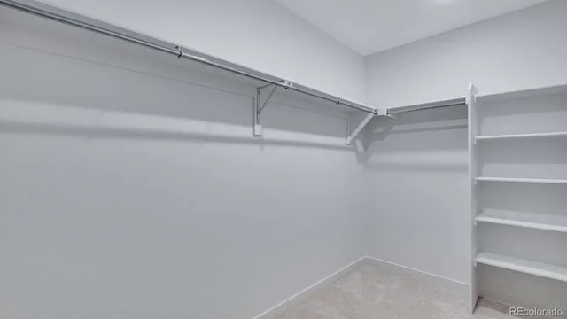 a view of an empty walk in closet