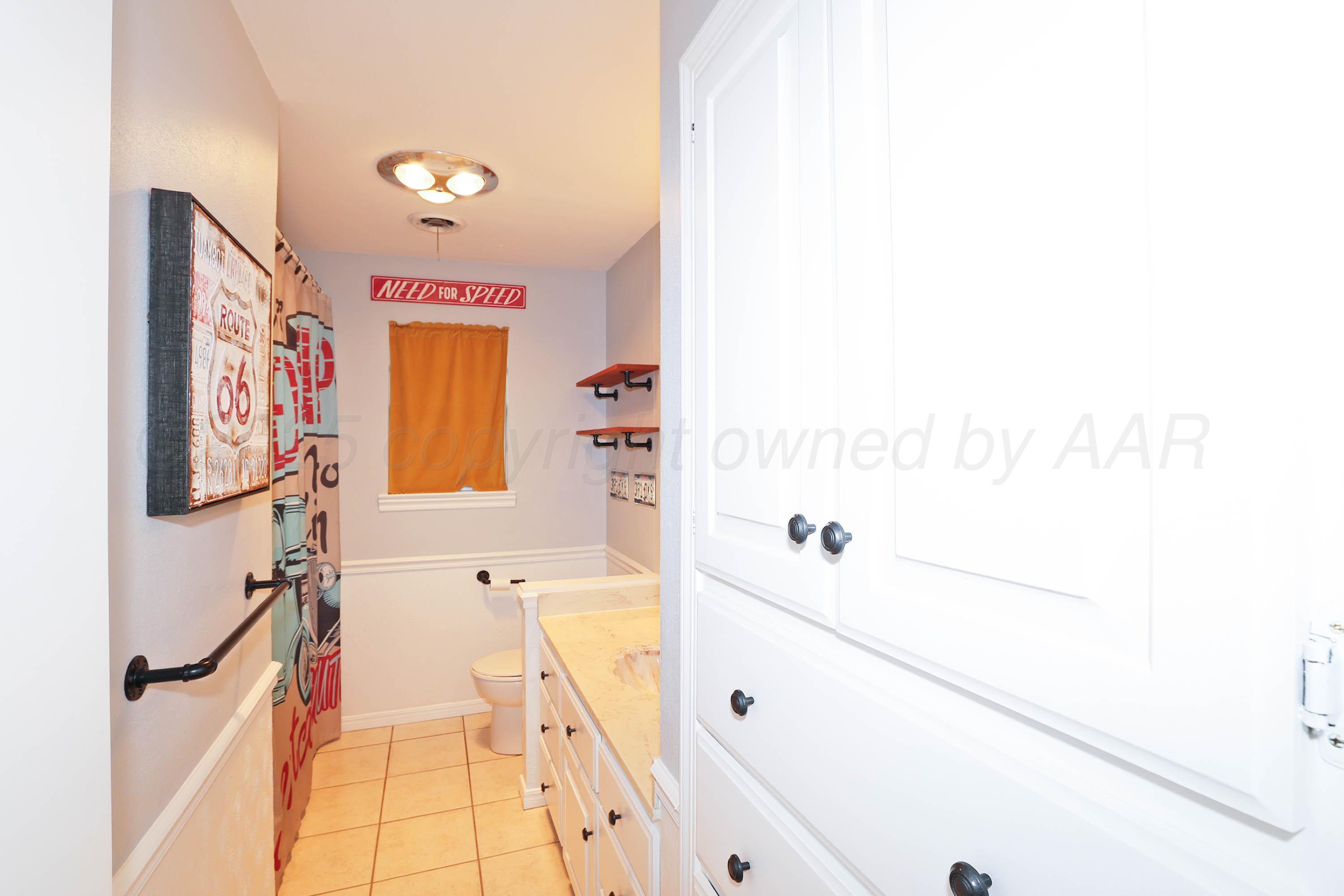 6006 Elmhurst Road Amarillo, TX 79106 - Photo 25 of 35 a bathroom with a bathtub and shower